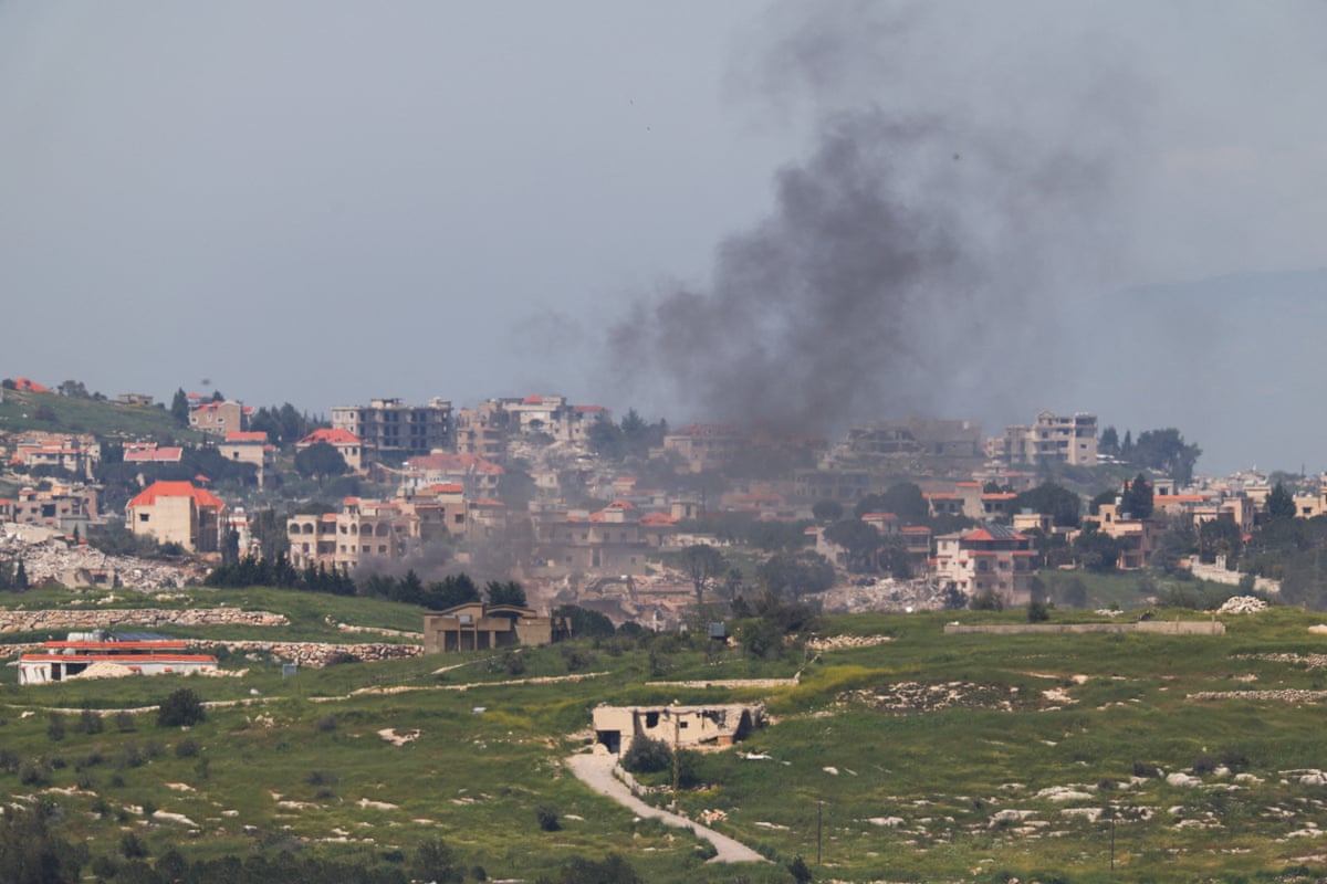 Distant view of smoking rising in Lebanon, as seen from the Israeli side of the border.