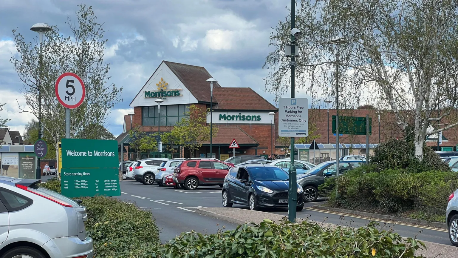 The Morrisons store in Aldridge, where Sean Egan worked for 29 years before his dismissal. A protest is planned outside the supermarket on Saturday morning. Cars fill the car park beneath a cloudy sky.