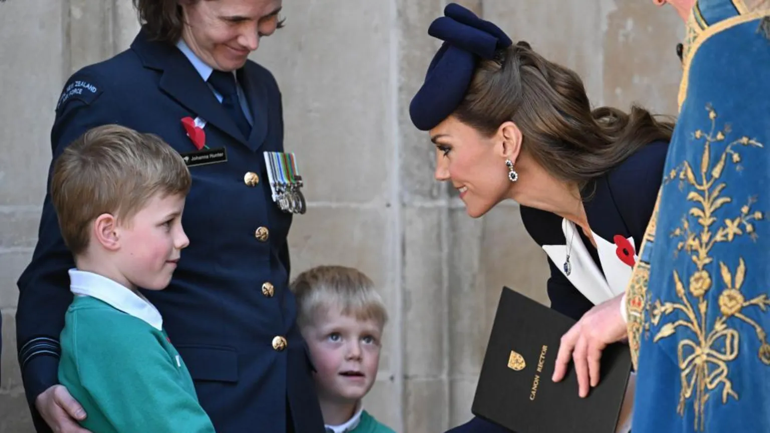  The Princess of Wales speaks to a boy as she leaves the service of commemoration for Anzac Day at Westminster Abbey