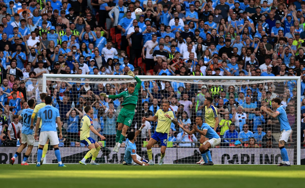 Manchester City's Omar Marmoush sends his shot high into the stands.