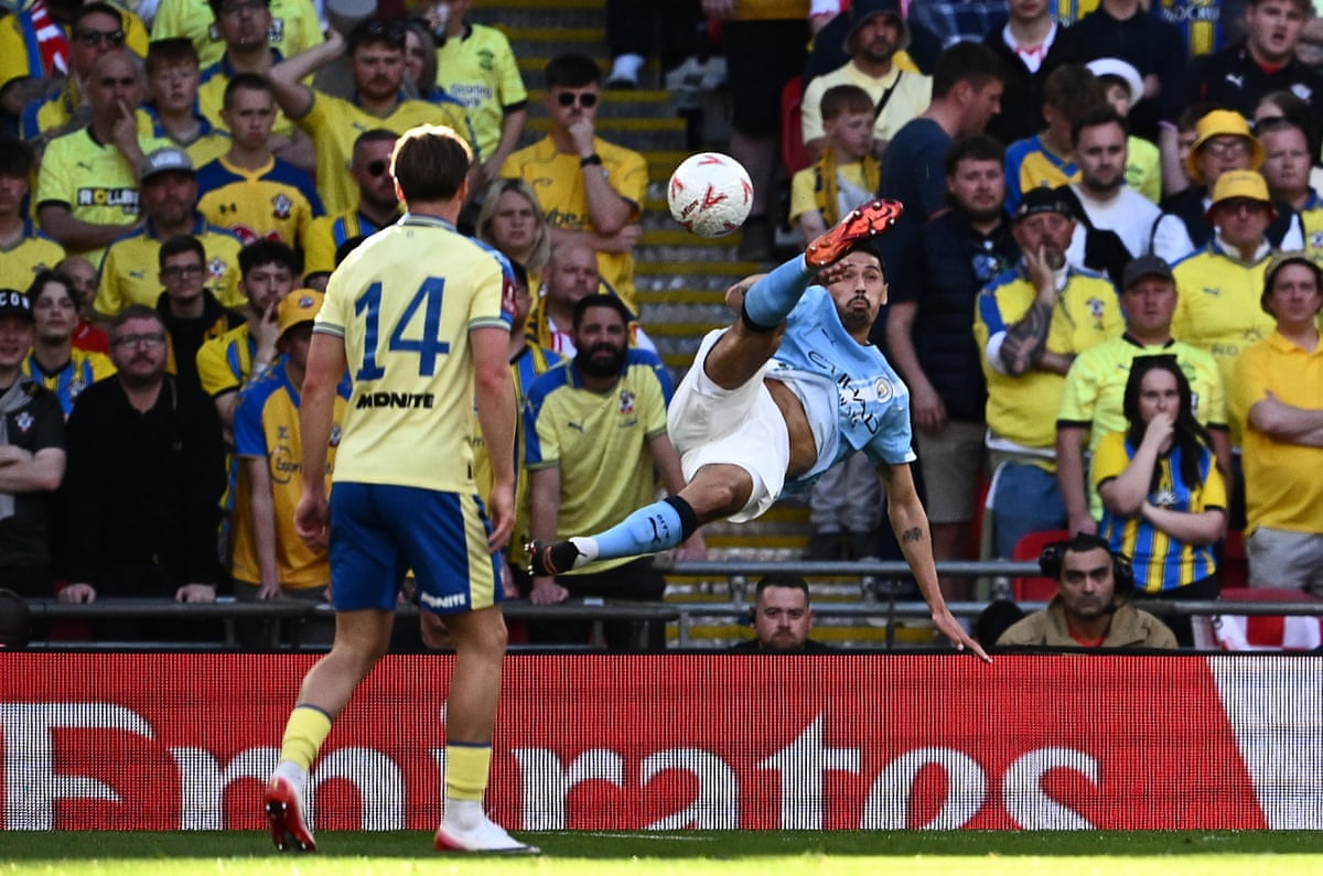 Manchester City's Tijjani Reijnders tries an overhead kick.