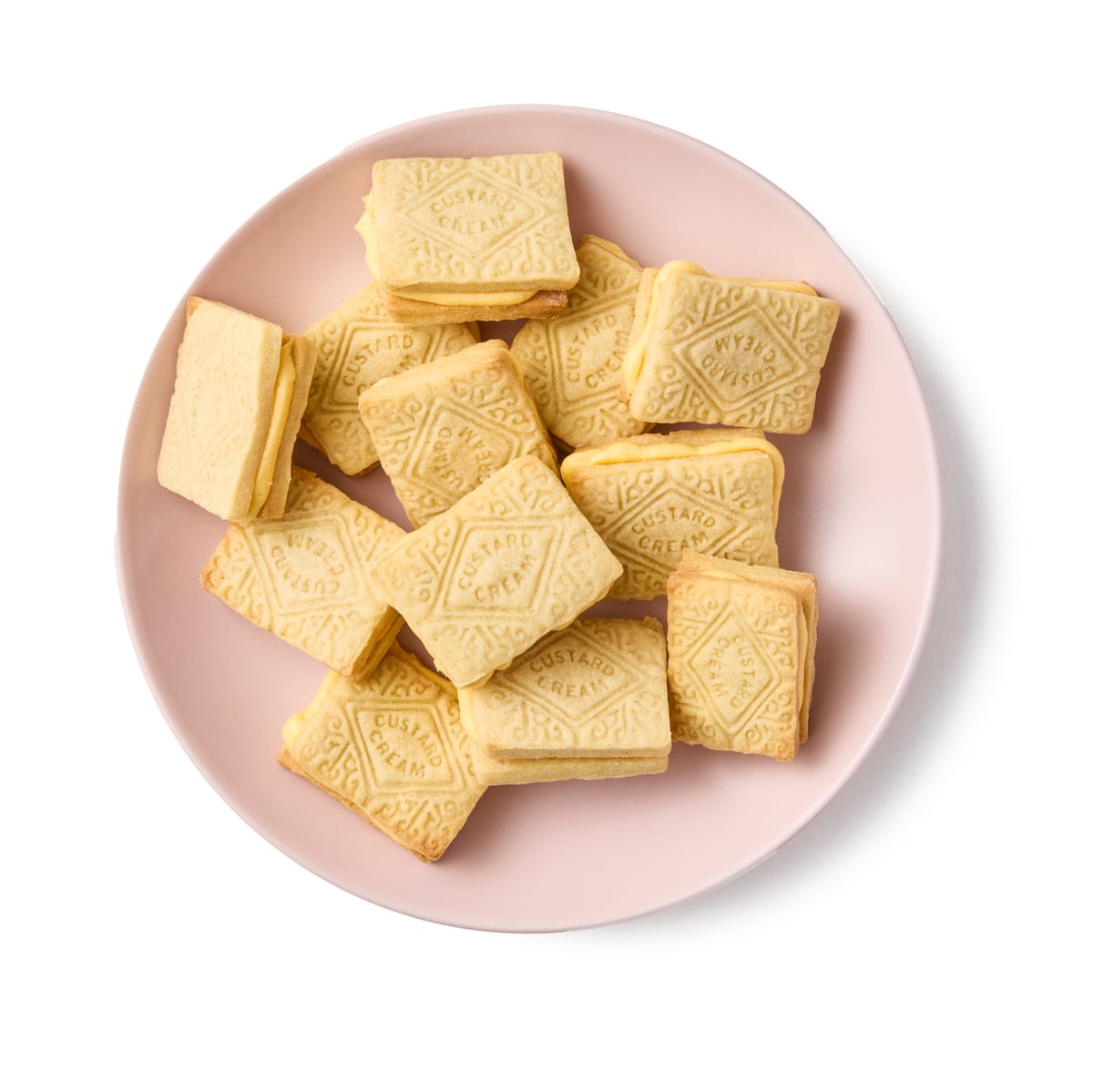 Felicity Cloake’s custard creams on a pink plate: not so prosaic if you make them at home.