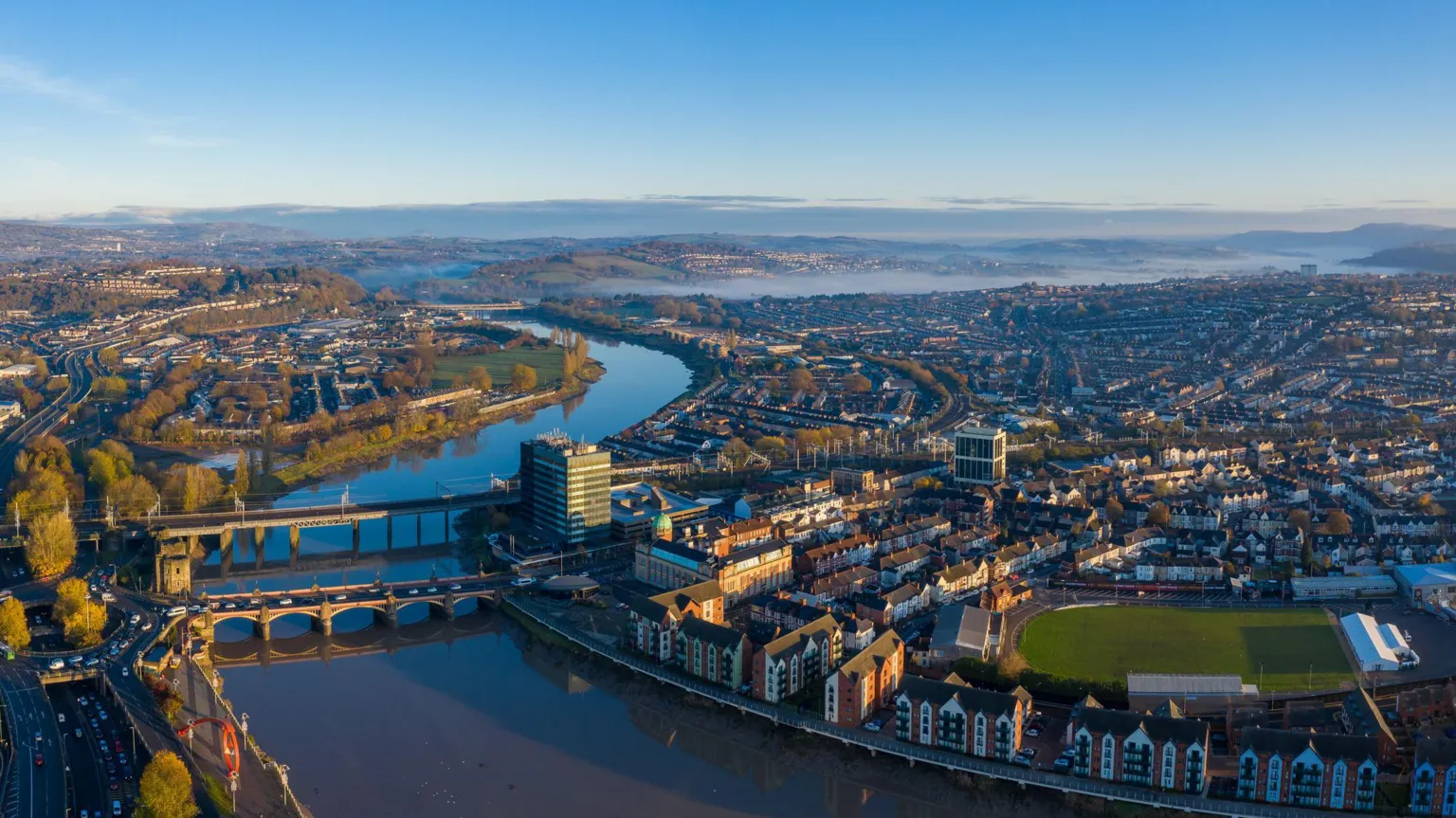  An aerial view at sunrise of Newport city centre, south wales United Kingdom, taken from the River Usk.