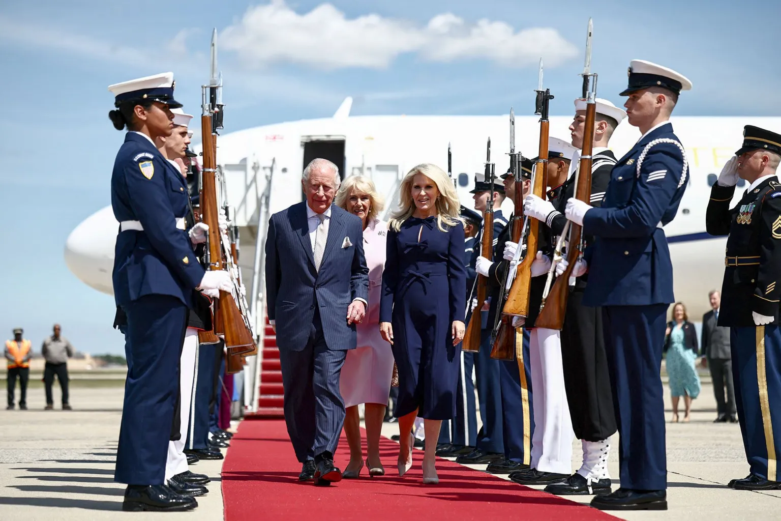 AFP via Britain's King Charles III and Queen Camilla are greeted by US Protocol Chief Monica Crowley as they arrive at Joint Base Andrews, Maryland, on April 27, 2026.