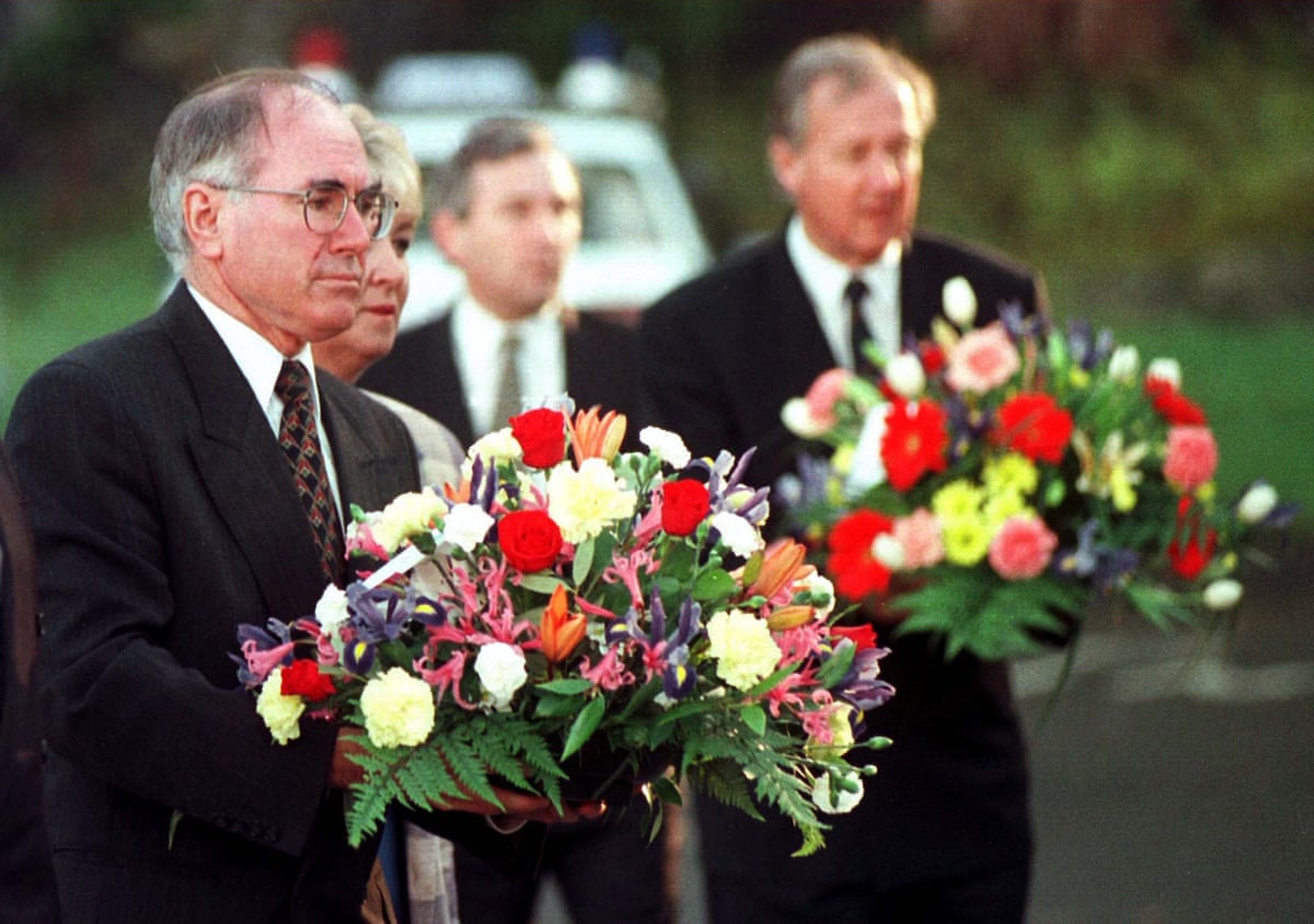 John Howard at a memorial for victims of the massacre in 1996
