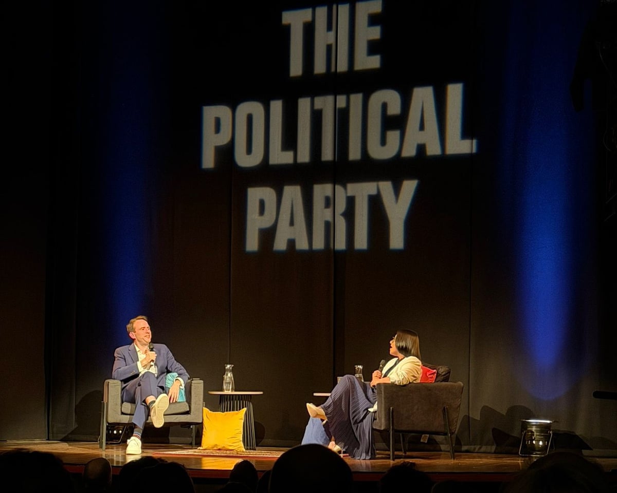Forde and Mahmood sat opposite each other on stage with The Political Party in large capitals on backdrop.