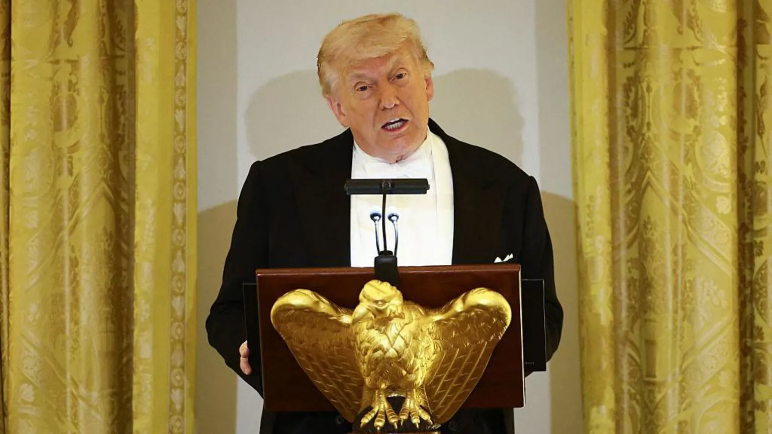  US President Donald Trump speaks at a golden eagle lectern