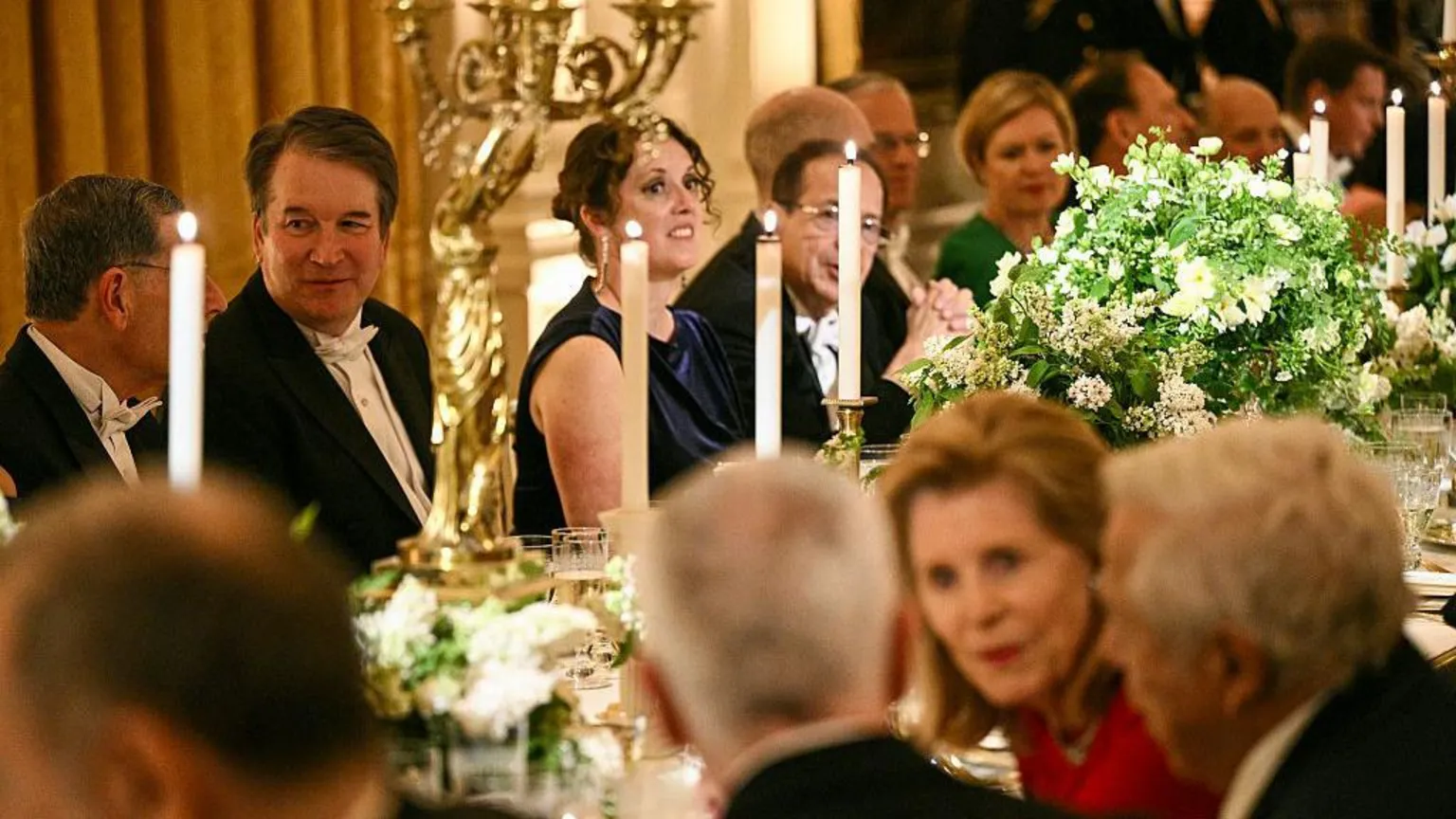 AFP via US Supreme Court Associate Justice Brett Kavanaugh (2nd-L) attends a State Dinner with US President Donald Trump, First Lady Melania Trump, Britain's King Charles III and Queen Camilla in the East Room of the White House in Washington, DC, on April 28, 2026. (Photo by Brendan SMIALOWSKI / AFP via ) 