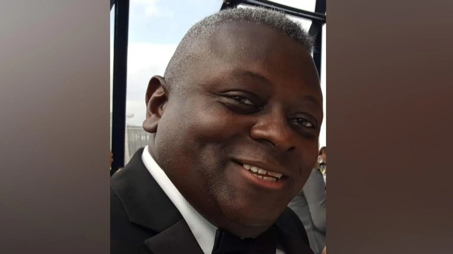 Family handout Norman Case smiles at the camera wearing a suit with a black bow tie and white shirt.