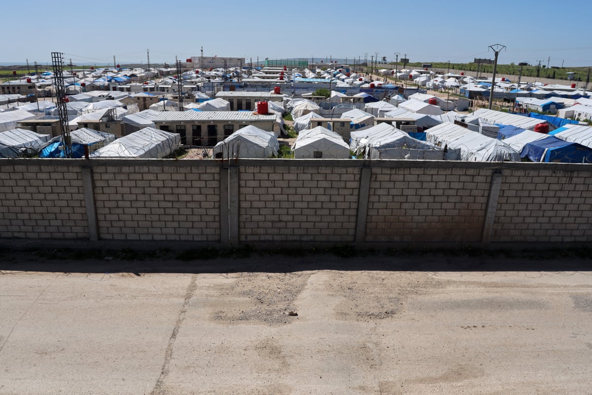 A brick wall surrounds Roj tent camp housing people with alleged ties to Islamic State in eastern Syria.
