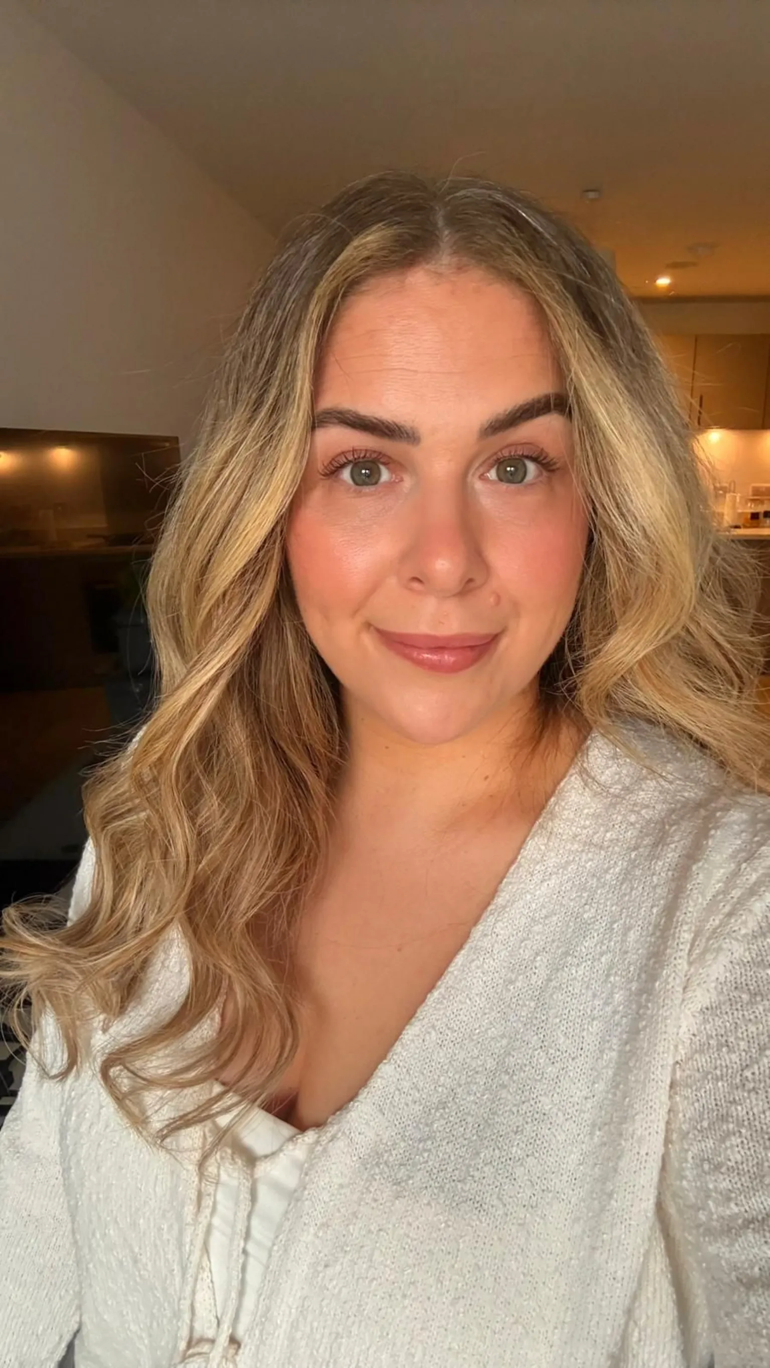 Gabriella Pearson Photo of a lady with long blonde hair wearing a white top. She is smiling.