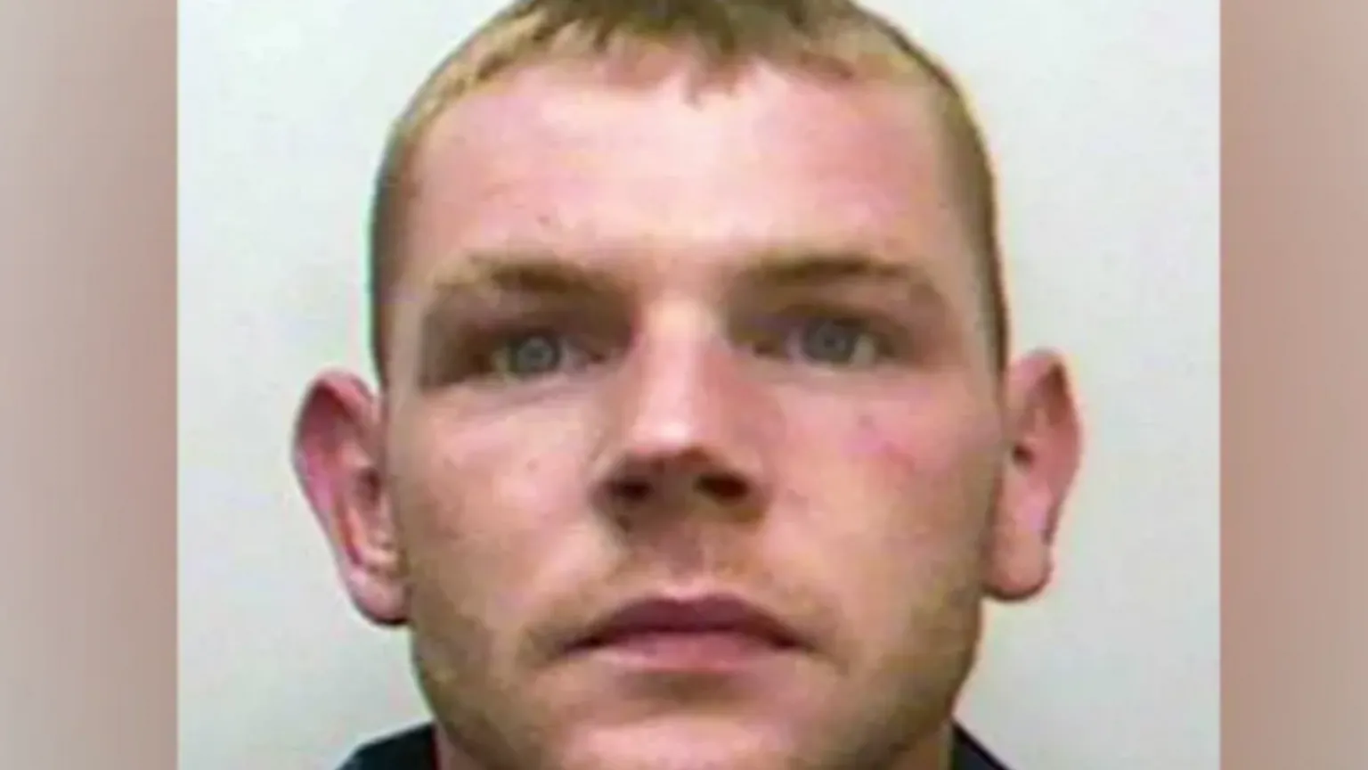 merseyside police Mugshot of Stephen. He has short blonde hair and large ears.