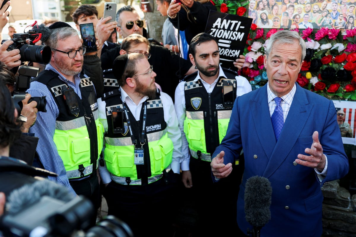 People gathered around Nigel Farage as he speaks to media. 