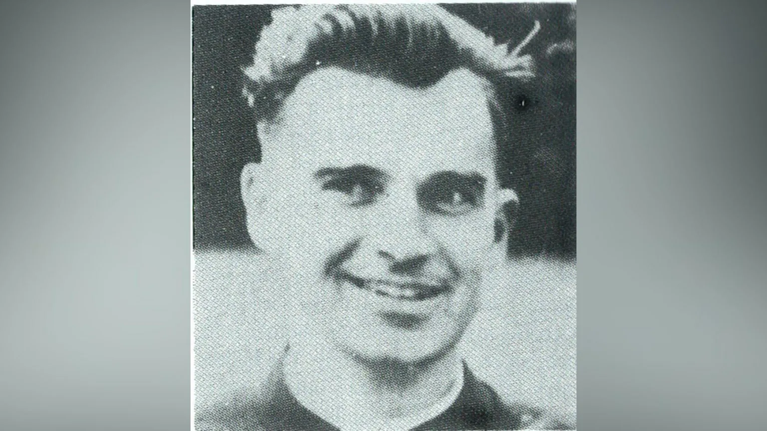 Family handout Black and white image of Fr Noel Fitzpatrick, blurred at the sides. He has dark hair, wearing priest clothing. He is smiling and looking off to his side.