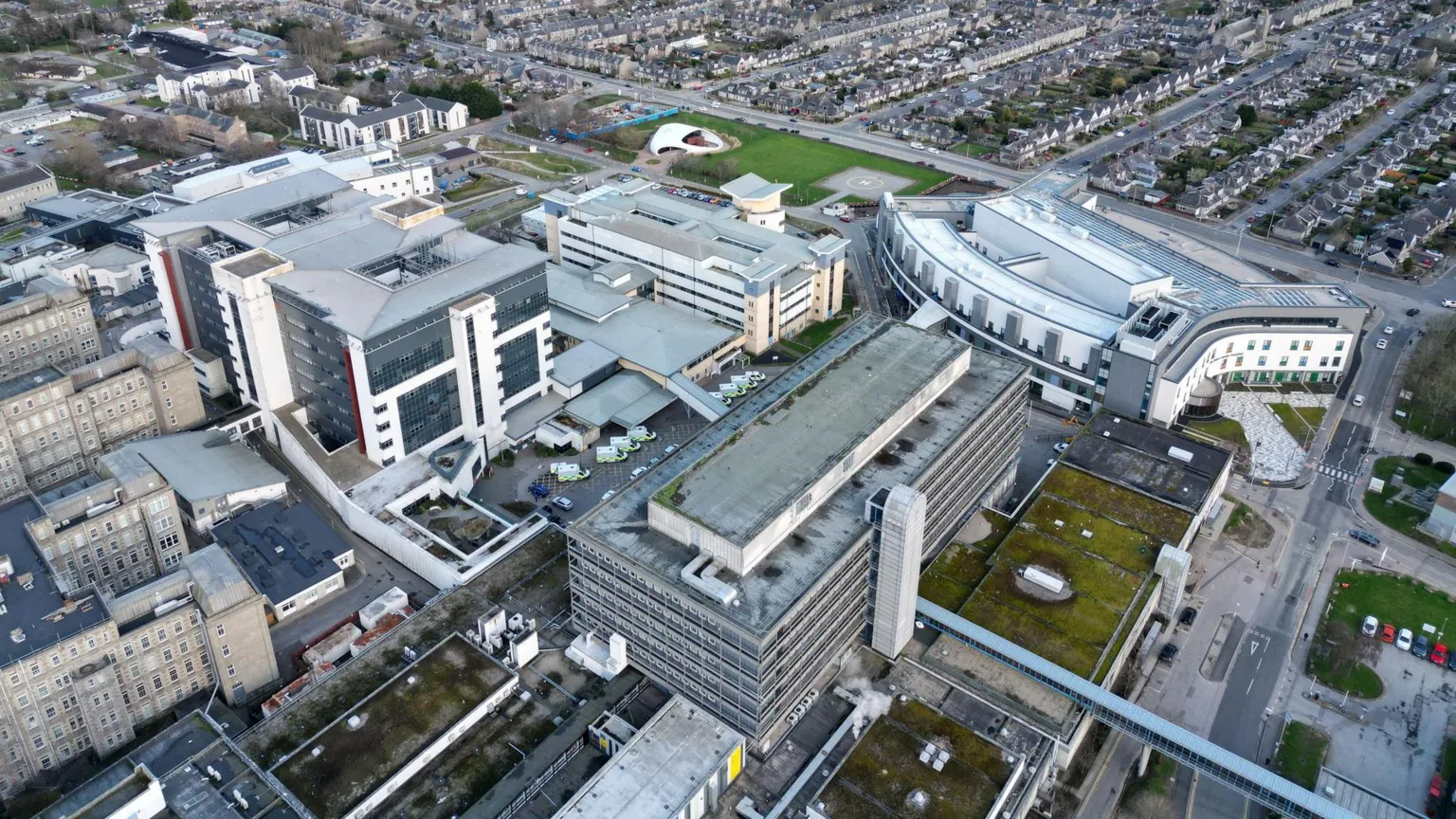  An aerial view of Aberdeen Royal Infirmary with surrounding buildings and ambulances queued outside