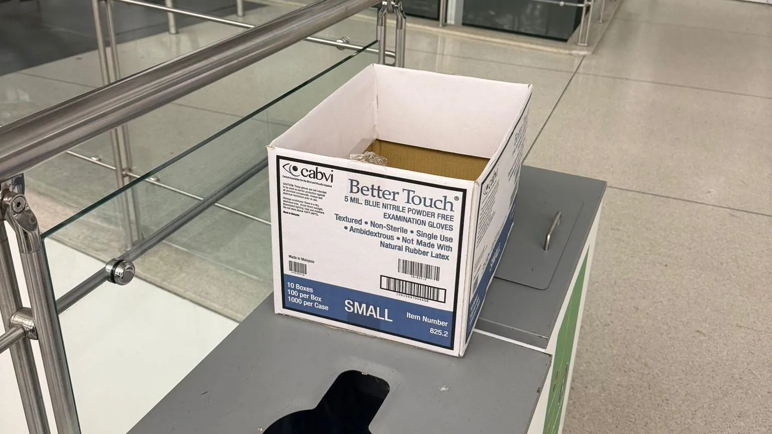 Pavel Talankin A white box with blue writing sits on a table in an airport 