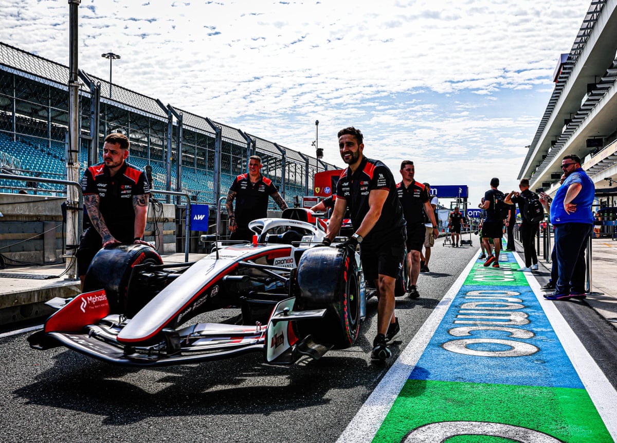 Haas team members working with their car in Miami