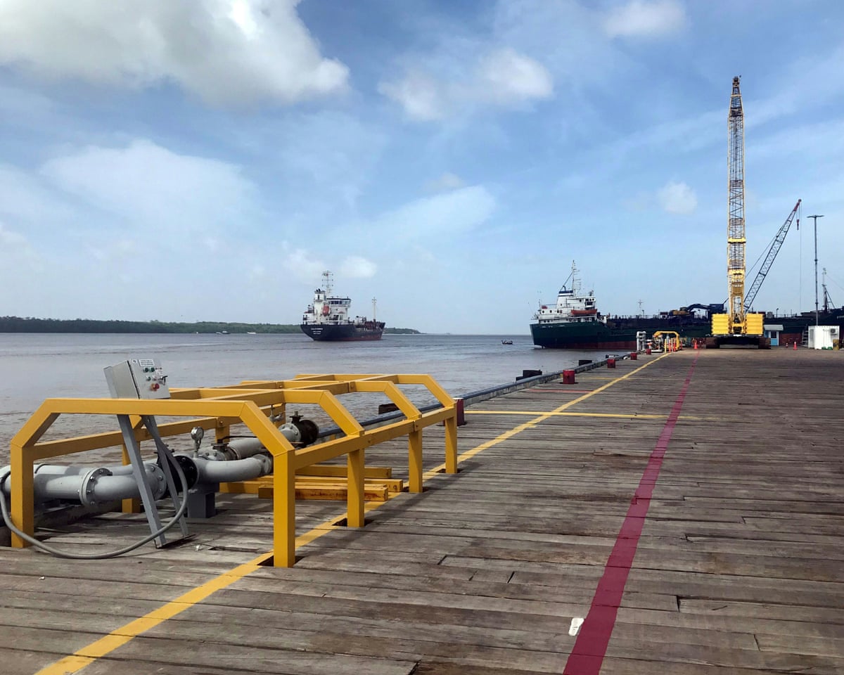 Vessels carrying supplies for an offshore oil platform operated by ExxonMobil are seen in Guyana on the Demerara River.