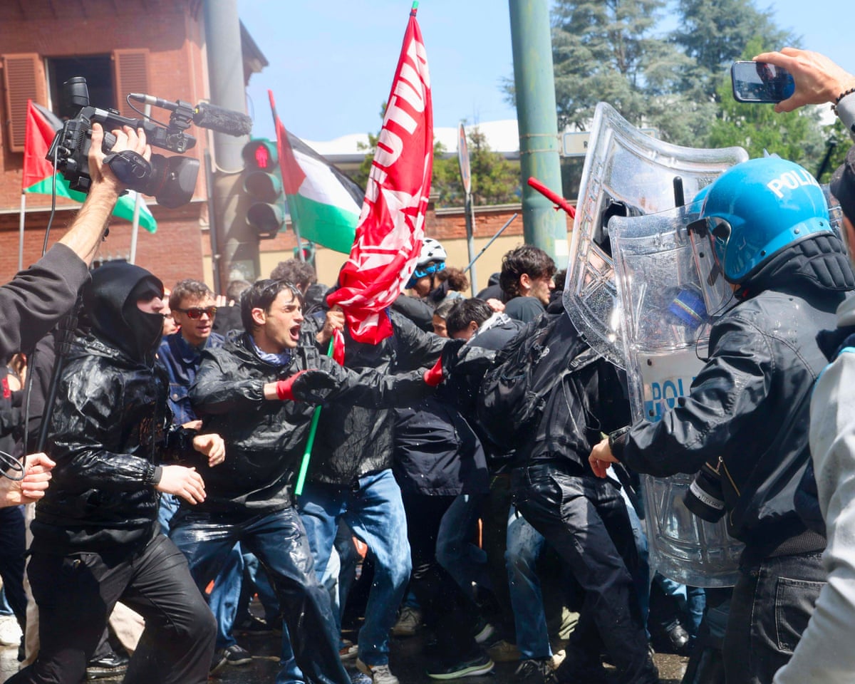 Demonstrators clashes with police during a May Day march, in Turin, Italy.