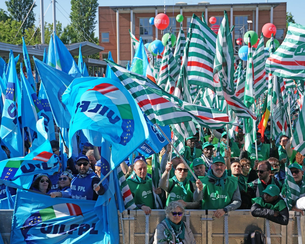 People take part in the national demonstration called by the Cgil, Cisl and Uil unions to mark Labor Day in Marghera, Venice, Italy.