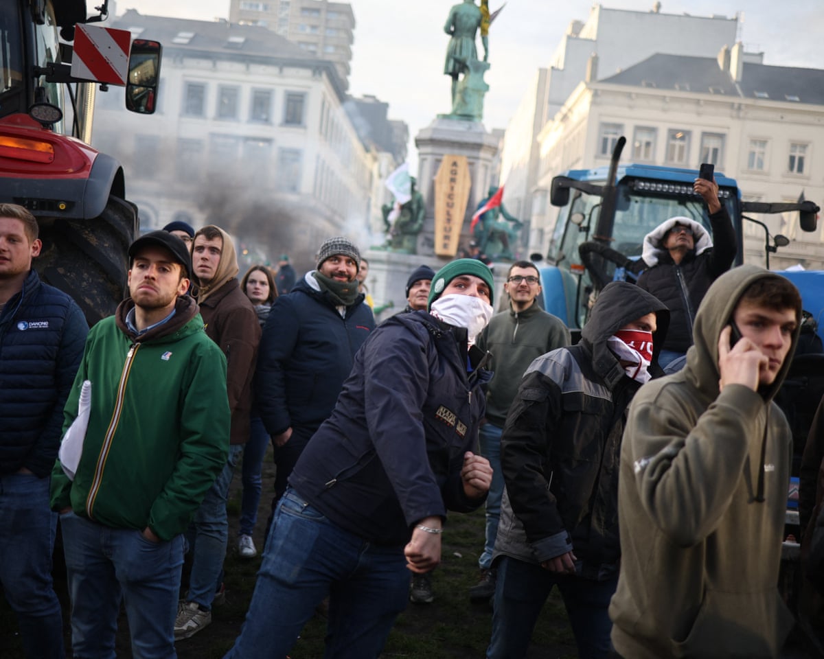 Clashes between protesters and riot police at the entrance to the European Parliament in Brussels, Belgium.