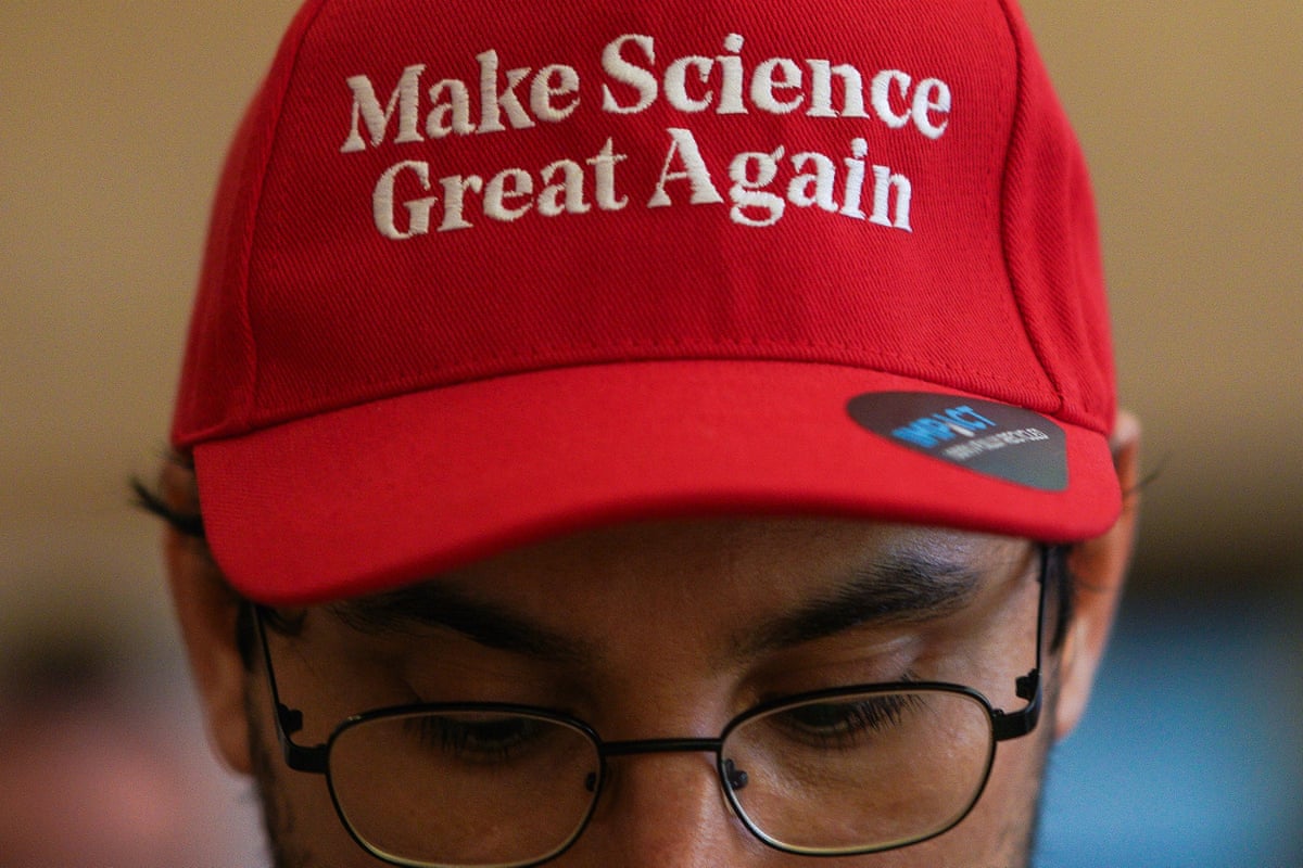 Man wears a red cap that reads 'Make Science Great Again' 