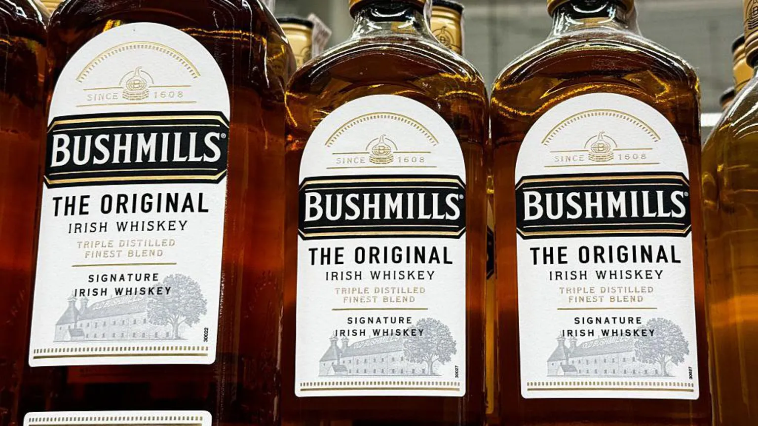  Bottles of Bushmills whiskey sitting in a row. 
