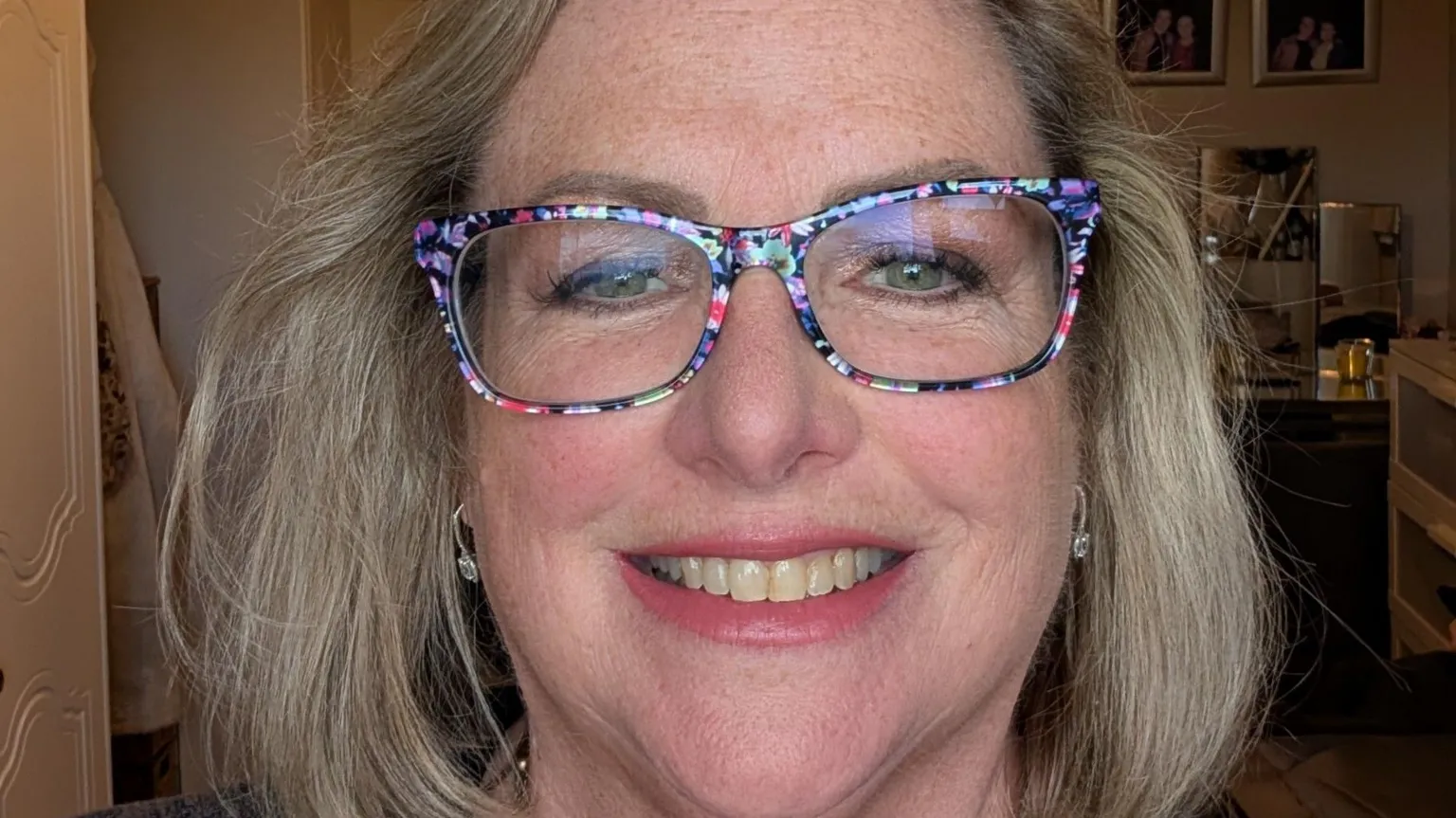Annie Kalotschke Annie Kalotschke has fair hair down to her shoulders and is wearing glasses with multi-coloured frames. She is smiling