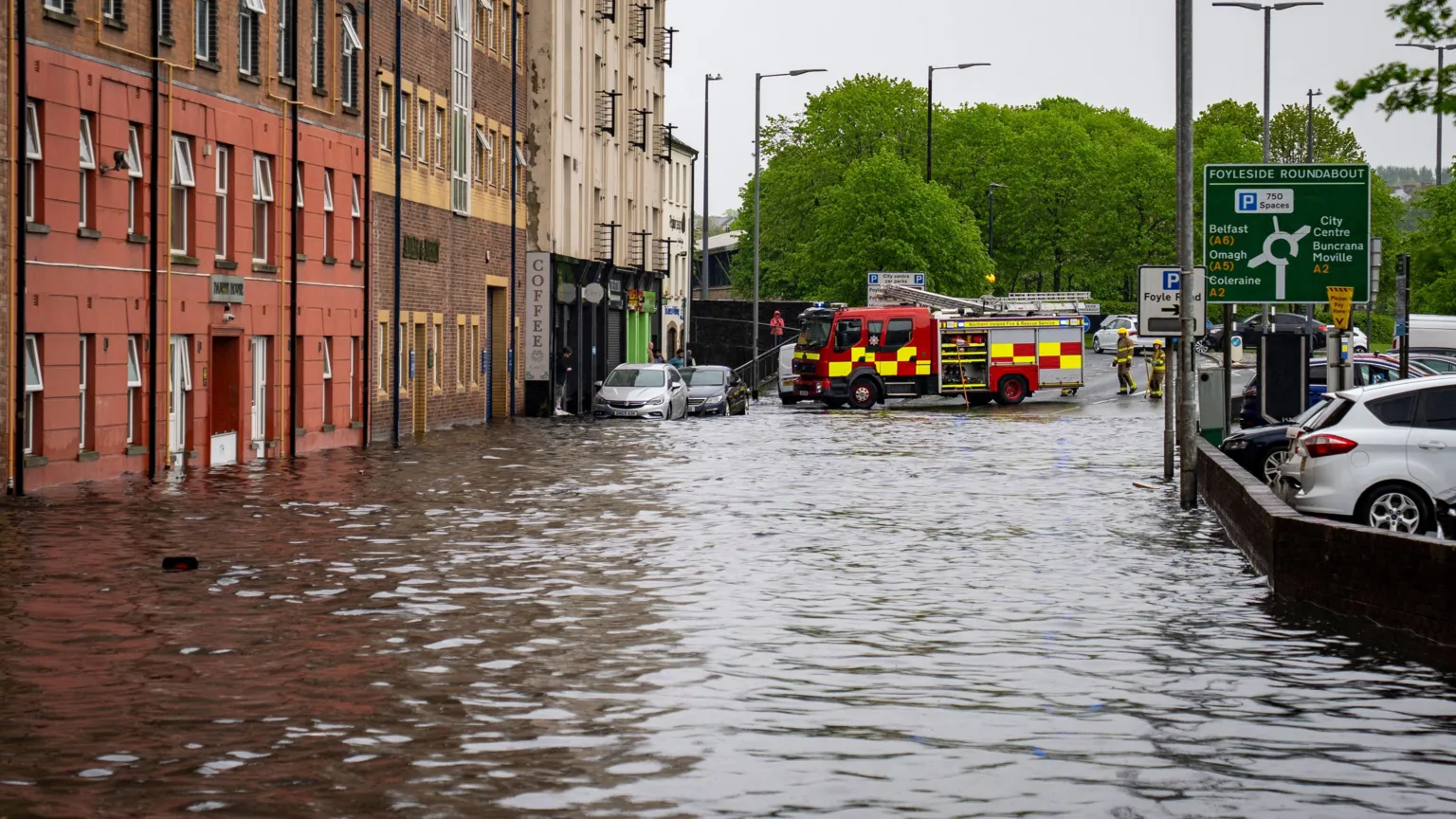Aodhán Roberts The picture shows Foyle Street flooded and firefighters at the top of it 