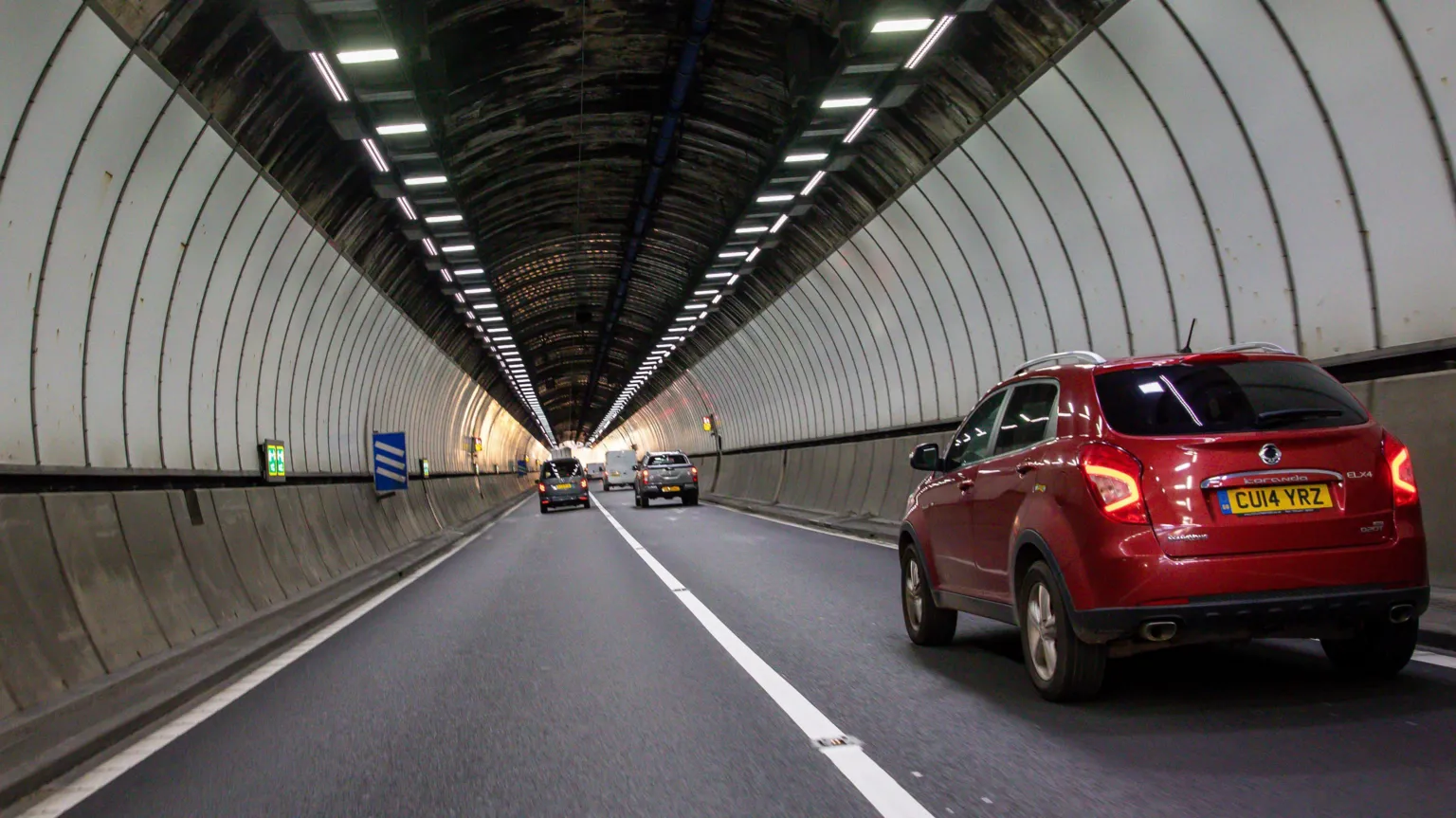 Huw Fairclough/ One of the two Brynglas Tunnels in Newport, with cars in both carriageways. A red car is closest to the camera on the right hand side.