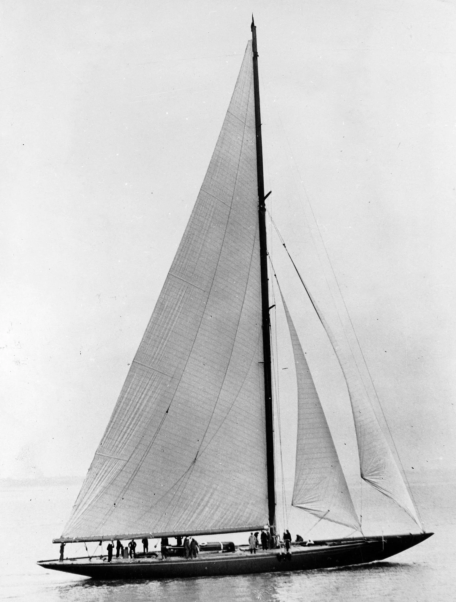 Roger Viollet Collection/Getty A black and white image of a racing yacht
