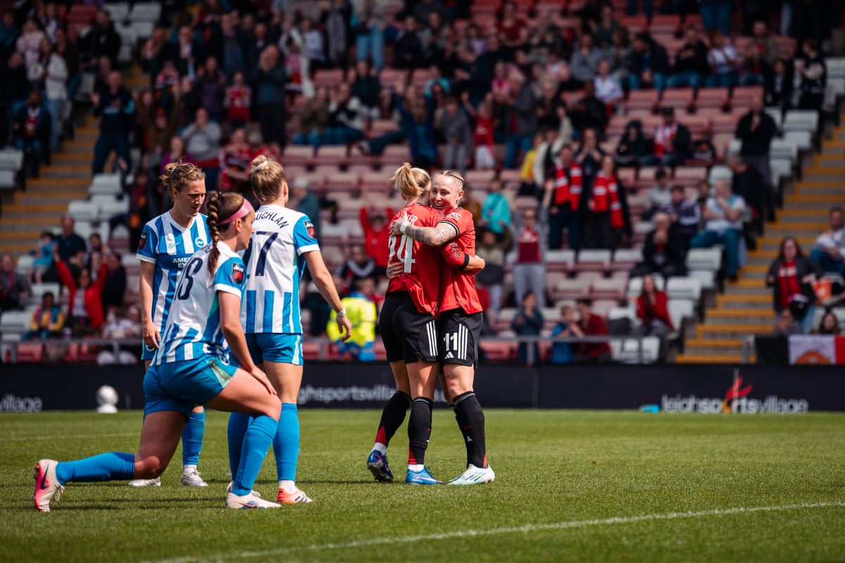 Lea Schüller celebrates scoring her goal with Leah Galton during Manchester United v Brighton
