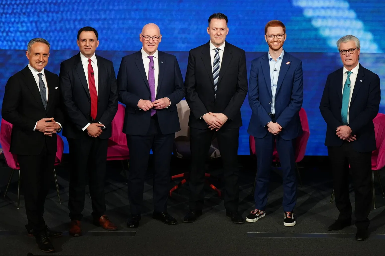  Alex Cole-Hamilton, Anas Sarwar, John Swinney, Russell Findlay, Ross Greer, Malcolm Offord wear suits and stand in a row