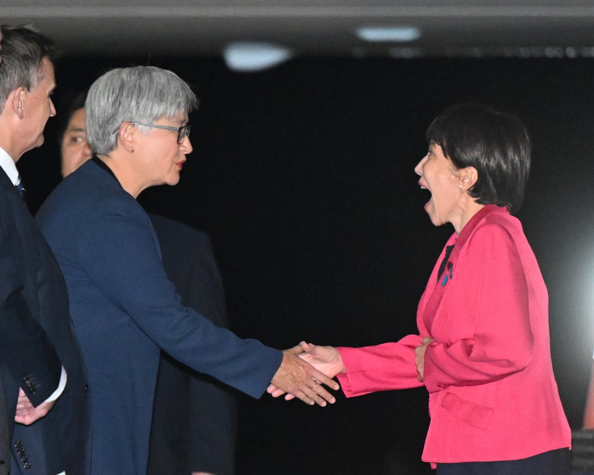 Penny Wong greets Japanese PM Sanae Takaichi at Fairbairn airport in Canberra