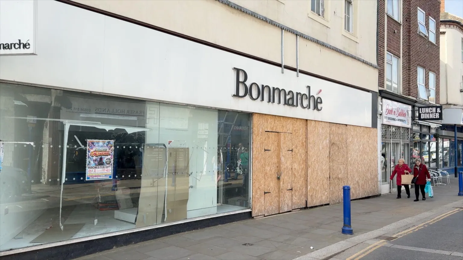 A high street on the Isle of Sheppey shows a boarded up Bonmarche shop.