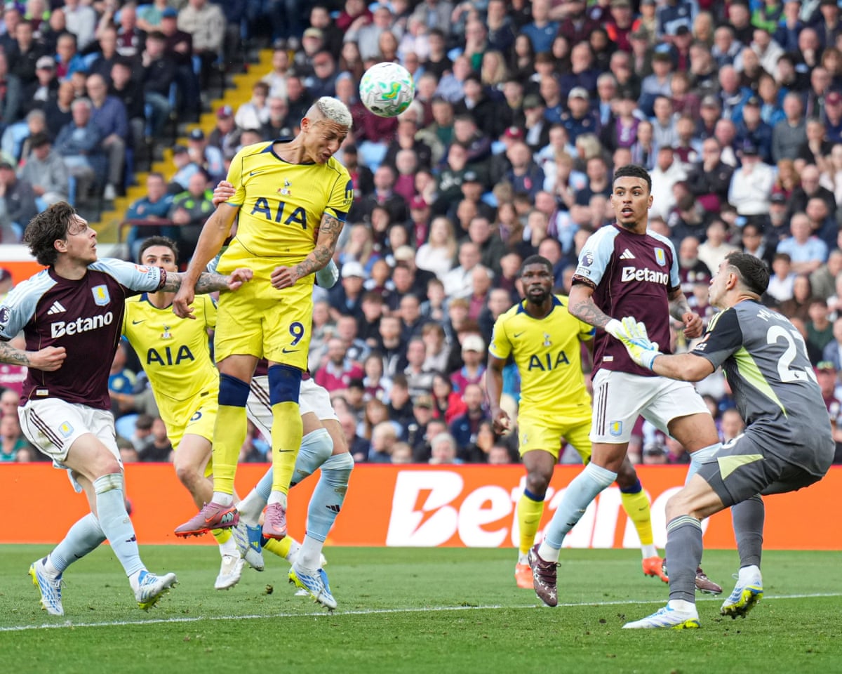 Richarlison of Tottenham Hotspur heads the ball to score against Aston Villa
