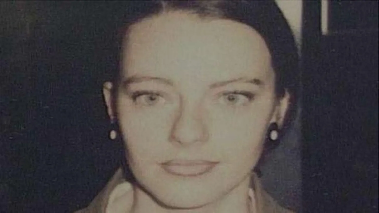 Tracey Wylde has dark hair scraped back and large black and white earrings. She is looking into the camera. 