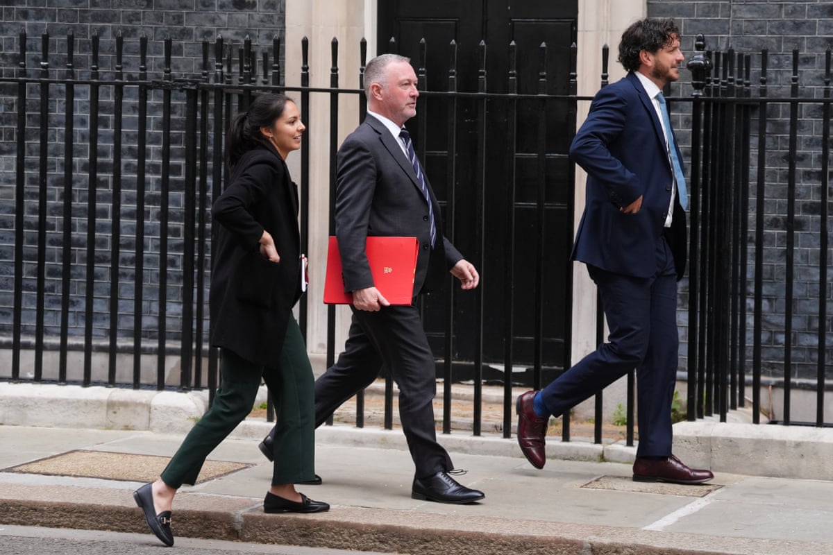 Steve Reed (centre) arriving for the Downing Street meeting on antisemitism this morning.
