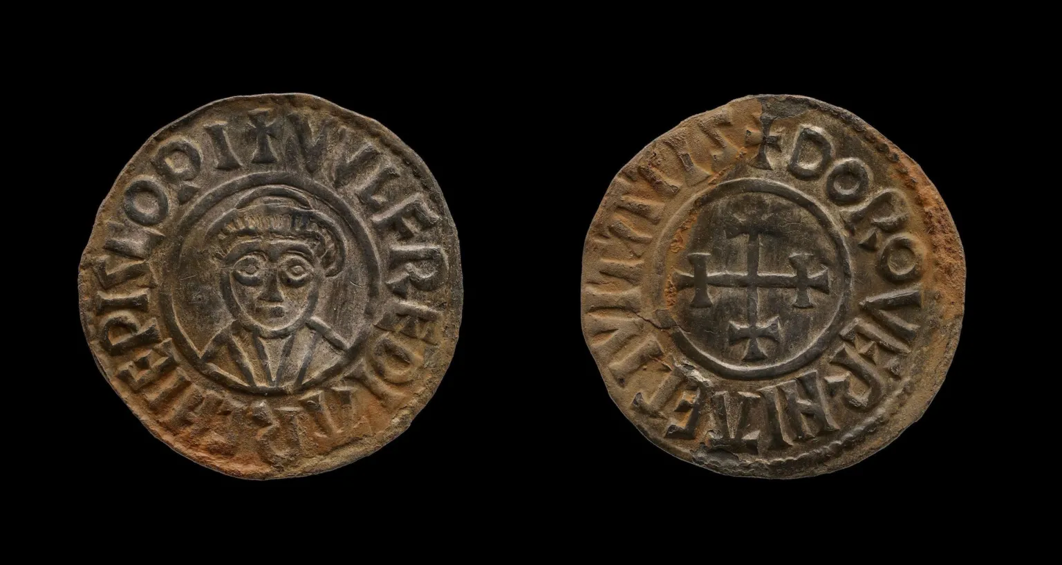 British Museum A small, silver coin, showing a bishop on one side and a cross on the other