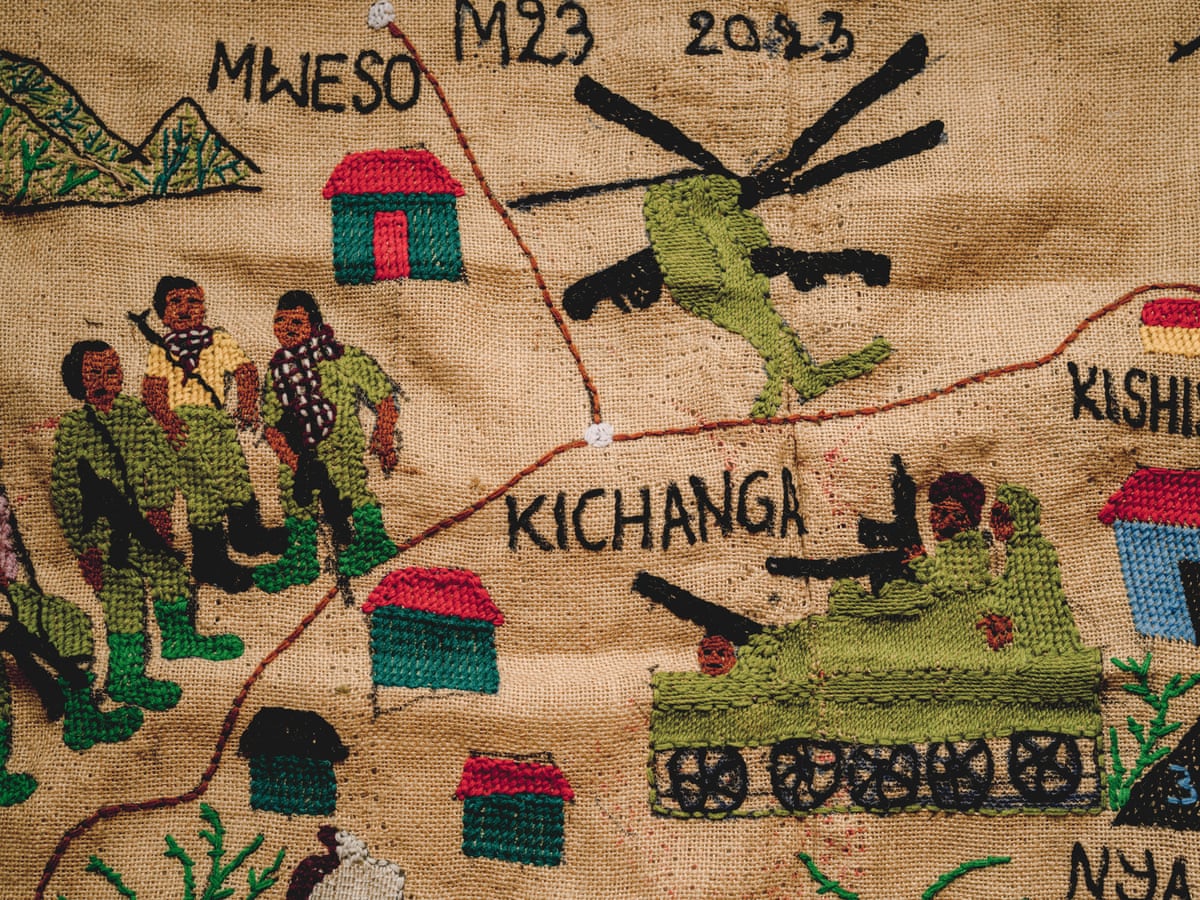 Tapestry of a military tank and helicopter next to a group of armed men.