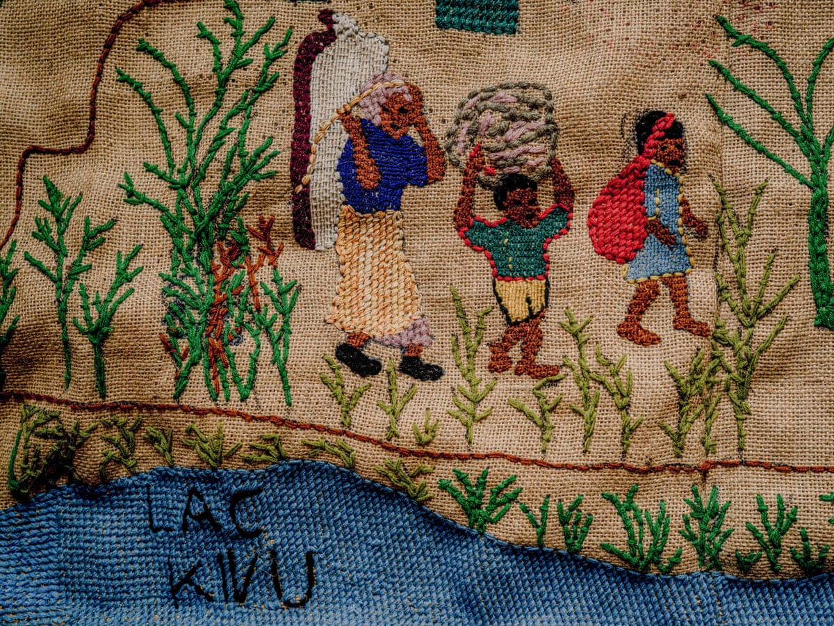Tapestry showing a family carrying bundles on their backs. 