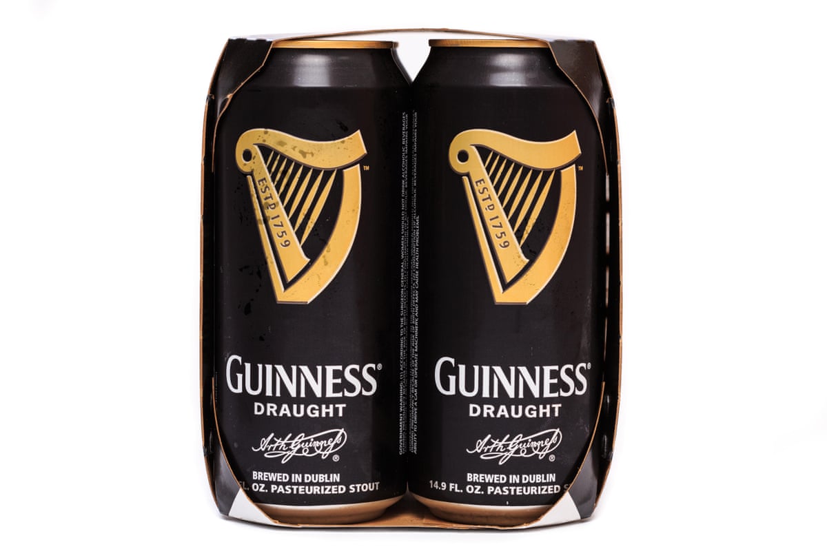 Chilled Guinness Draught beer with condensation on the cans.