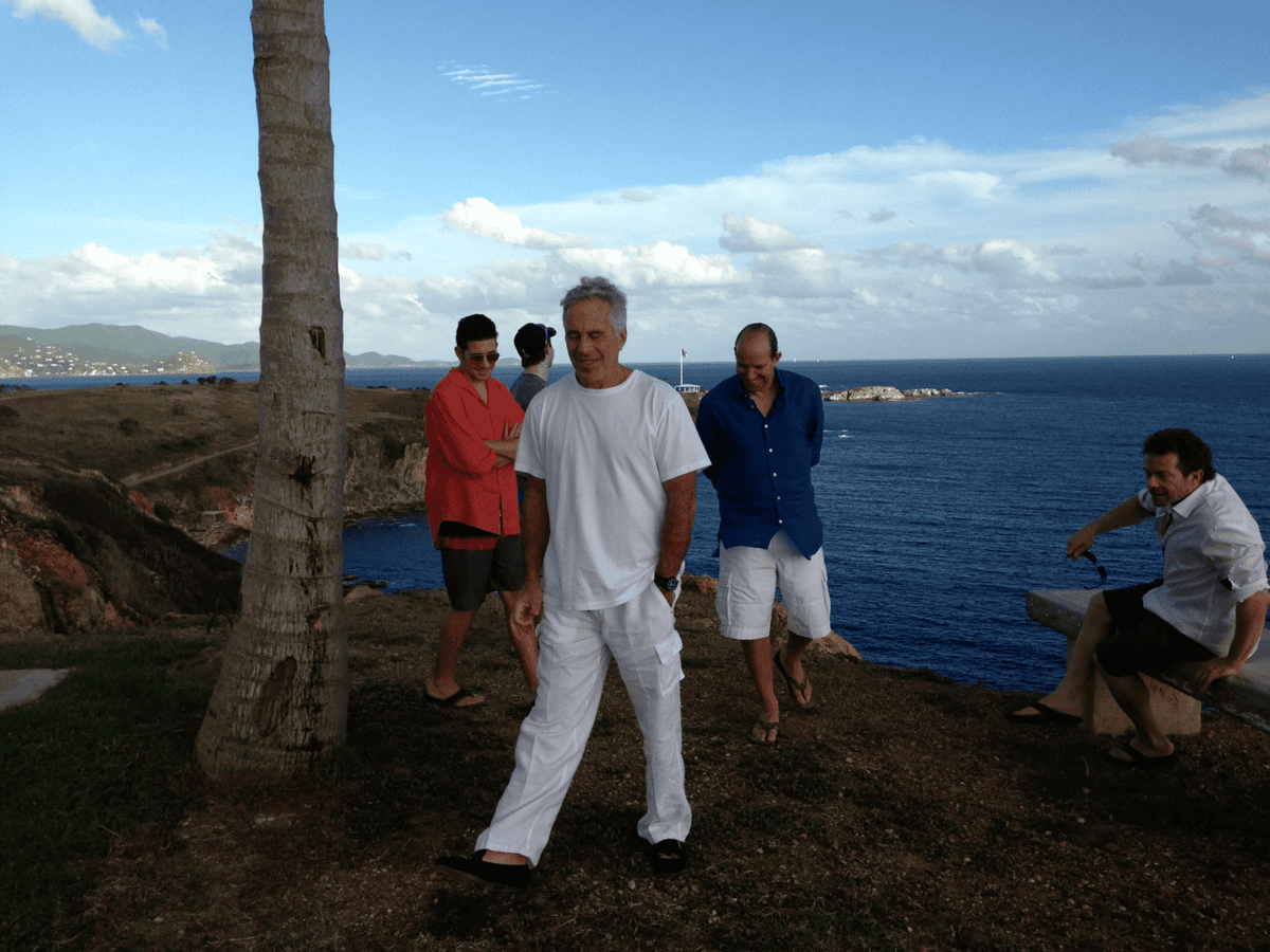 Jeffrey Epstein and Howard Lutnick, in blue shirt and white shorts