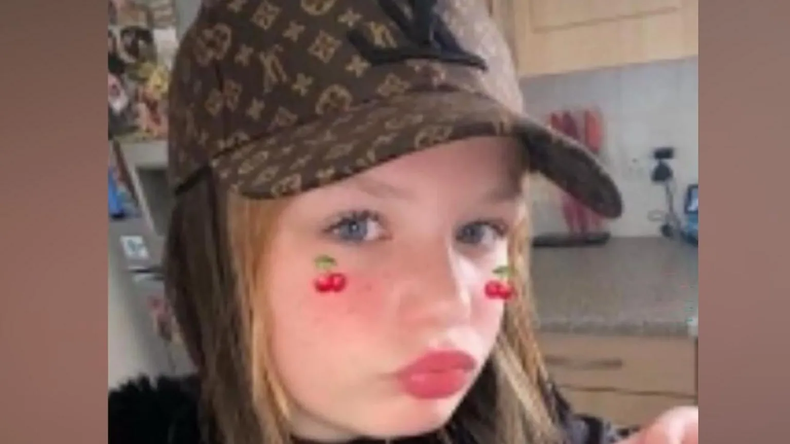 Family Handout A girl wearing a baseball cap and posing for the camera in a selfie-style image.