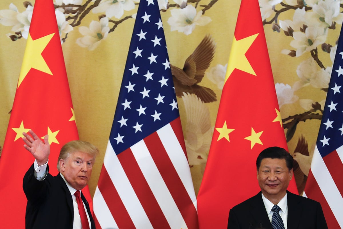 President Donald Trump waves next to Chinese president Xi Jinping at the Great Hall of the People in Beijing in 2017