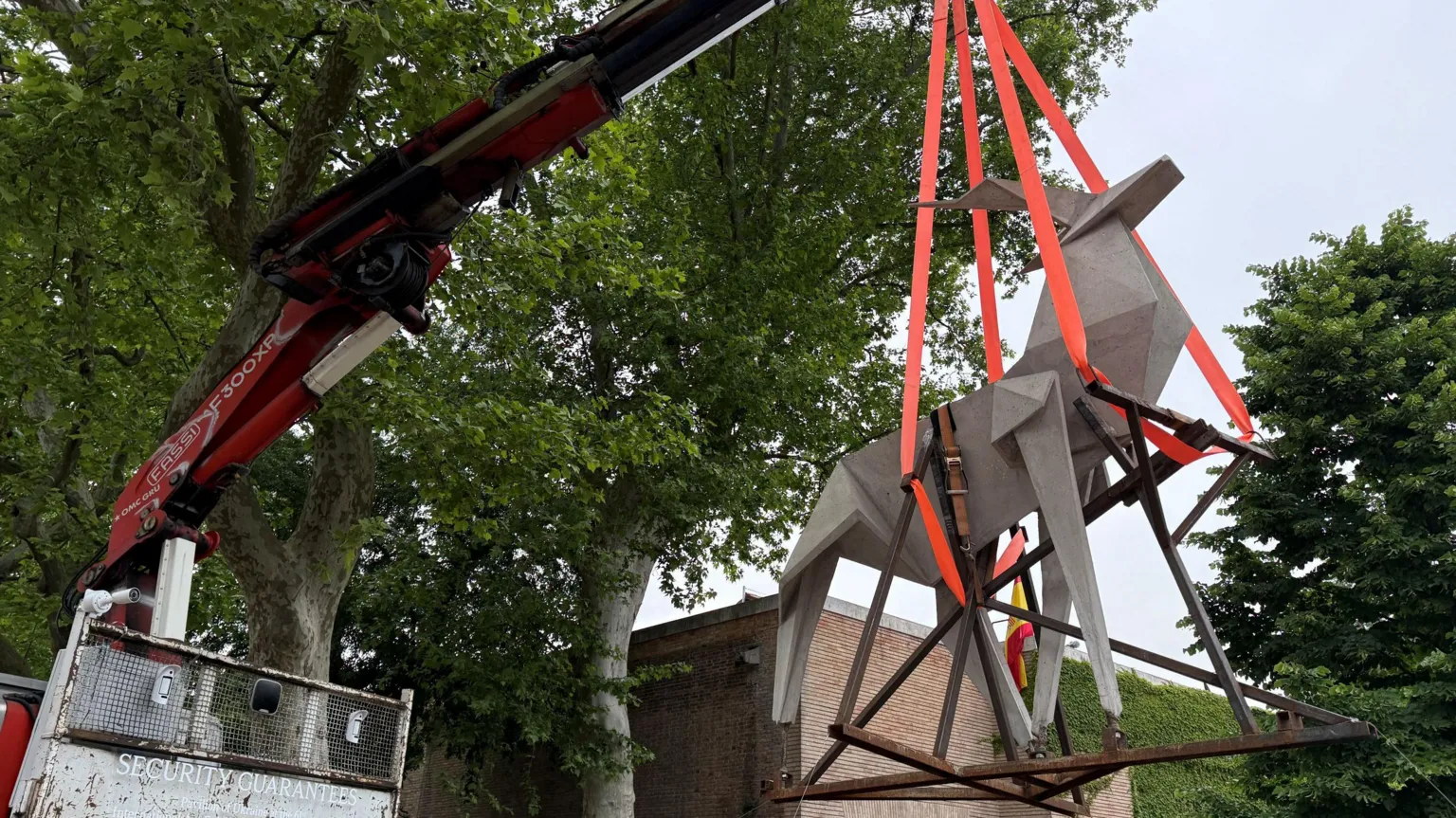 Zhanna Kadyrova A sculpture of an origami deer cast in concrete hangs suspended from a crane. It is the work of Ukrainian artist Zhanna Kadyrova. 