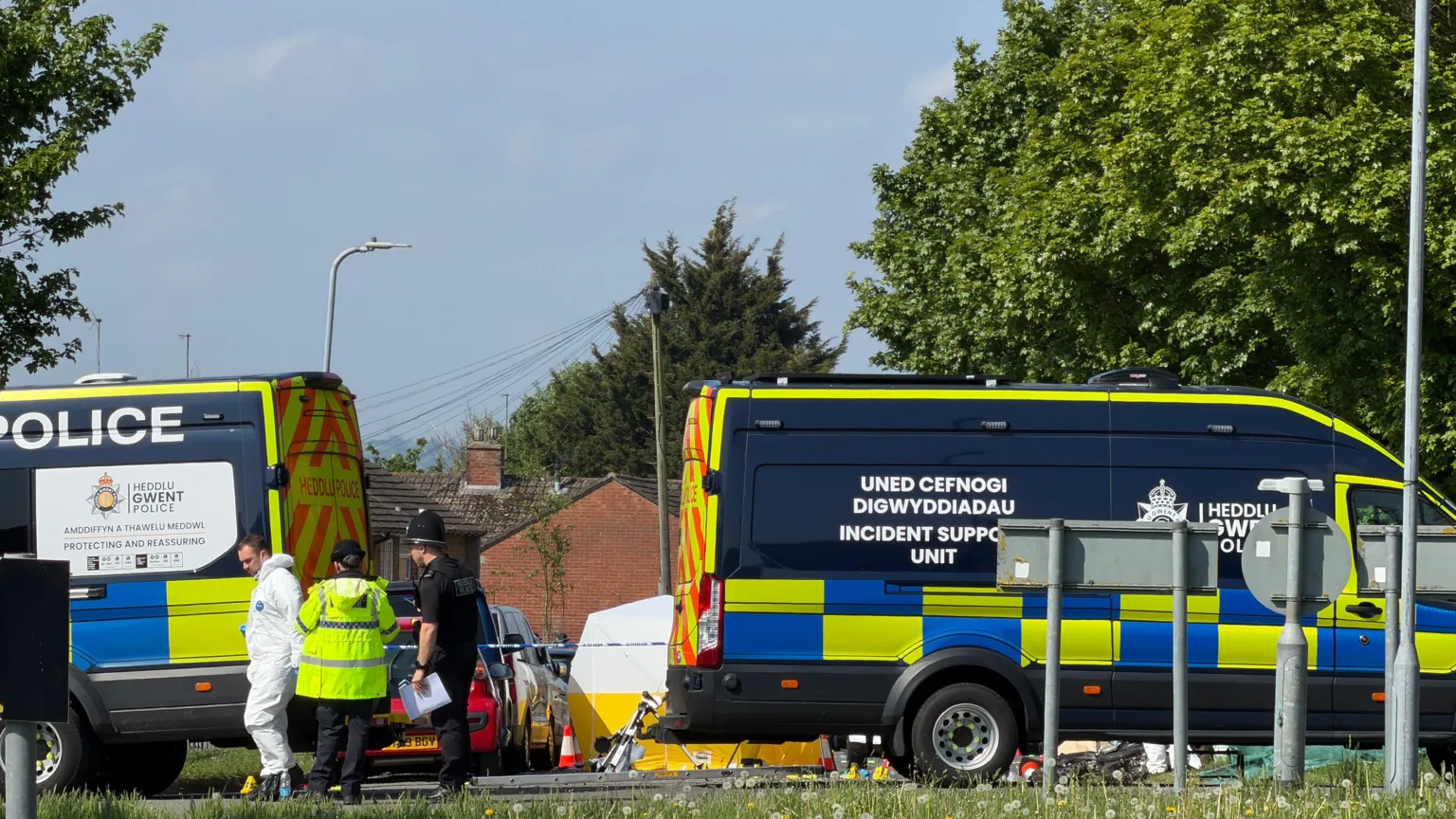 Emergency services staff and vehicles on Aberthaw Road. 