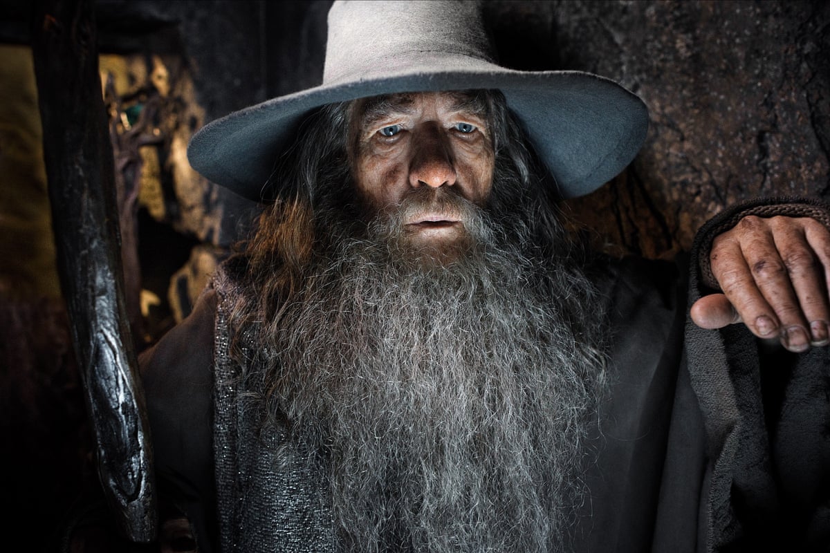 Close up of Sir Ian as Gandalf with a grey hat and holding his staff