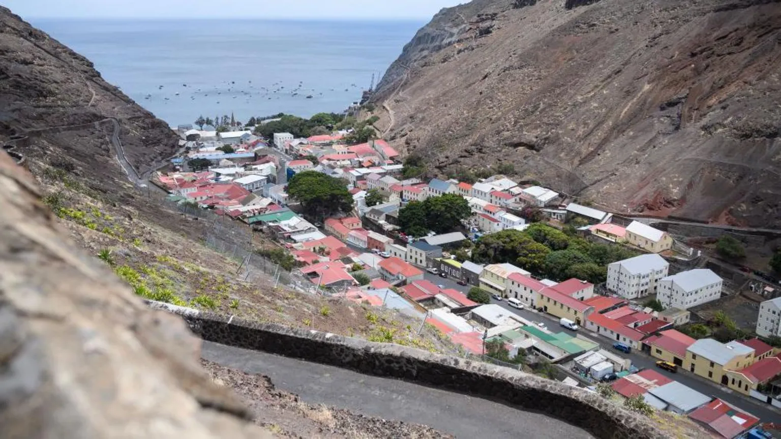  A view from above of several dozen houses in Jamestown, which are situated within a valley on St Helena