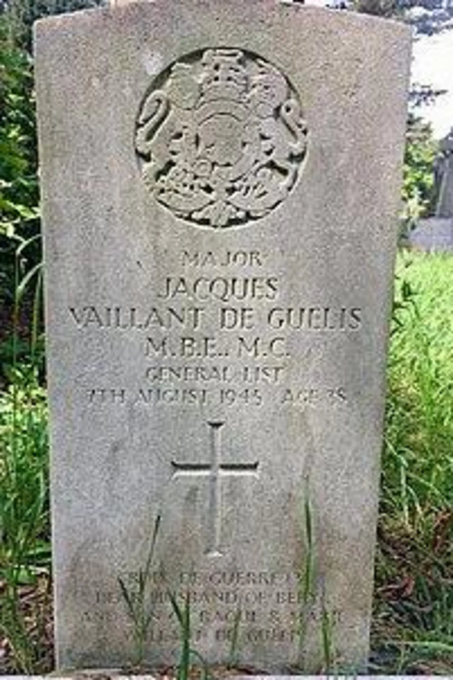 Friends of Cathays Cemetery A roughly 3ft high headstone bearing his name and military achievements. At its top is a carved representation of the Royal Coat of Arms emblem, showing a lion and unicorn 